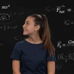 A smiling young woman surrounded by equations on a chalkboard.