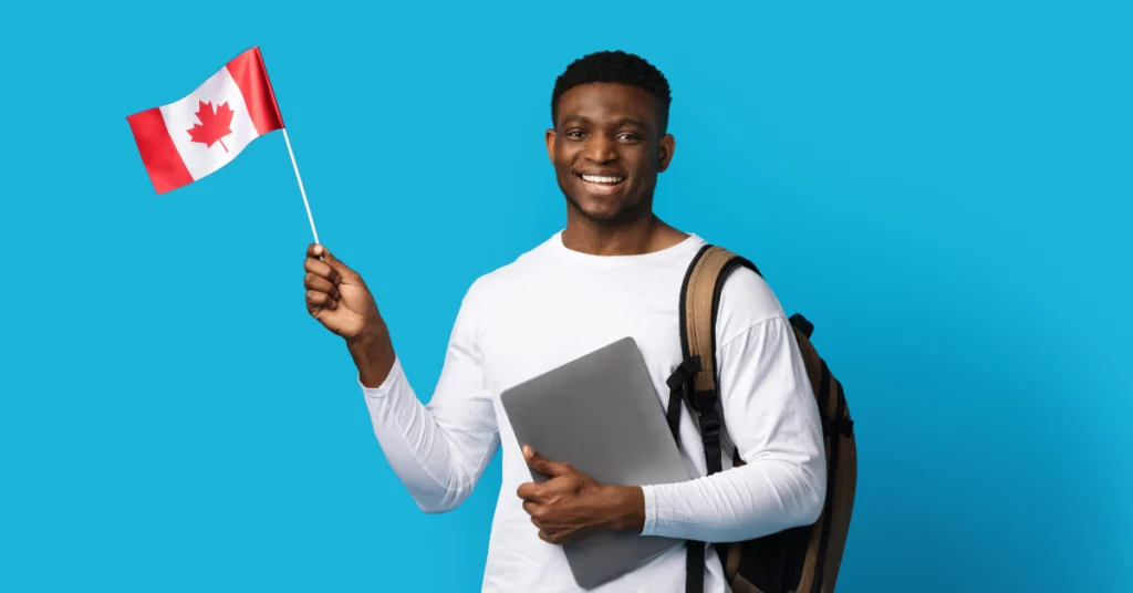 a picture of an international student waving a Canadian flag.